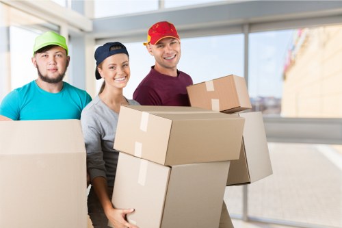 A local moving team preparing boxes for a house move in Hampton