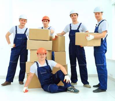 Careful loading of household boxes and furniture into a van