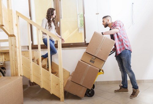 Removal crew loading a van during a Hampton relocation