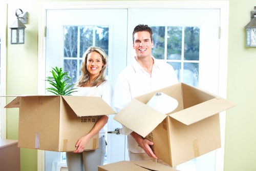 Professional removal team handling packed boxes in Hampton
