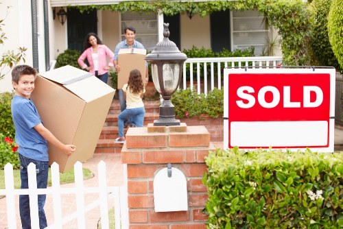 Household furniture being carried carefully through a Hampton property