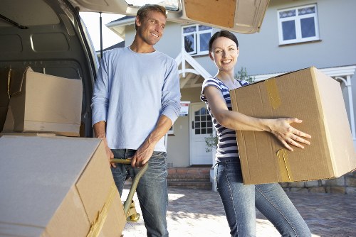 Local moving crew transporting household items in Hampton street